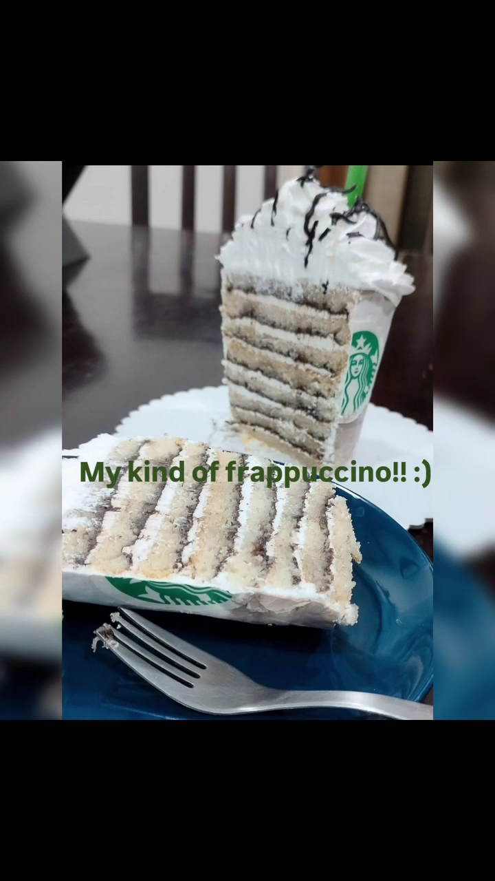 Layered cake shaped like a frappuccino cup, served sliced on a plate